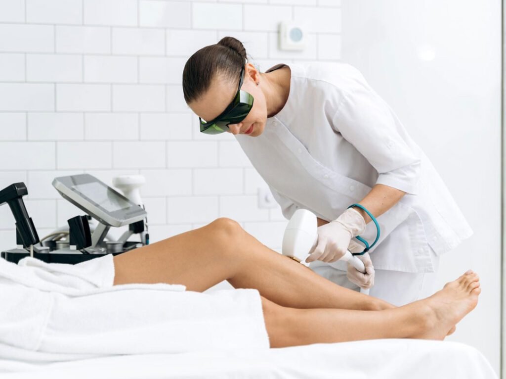Laser hair removal on a client's leg