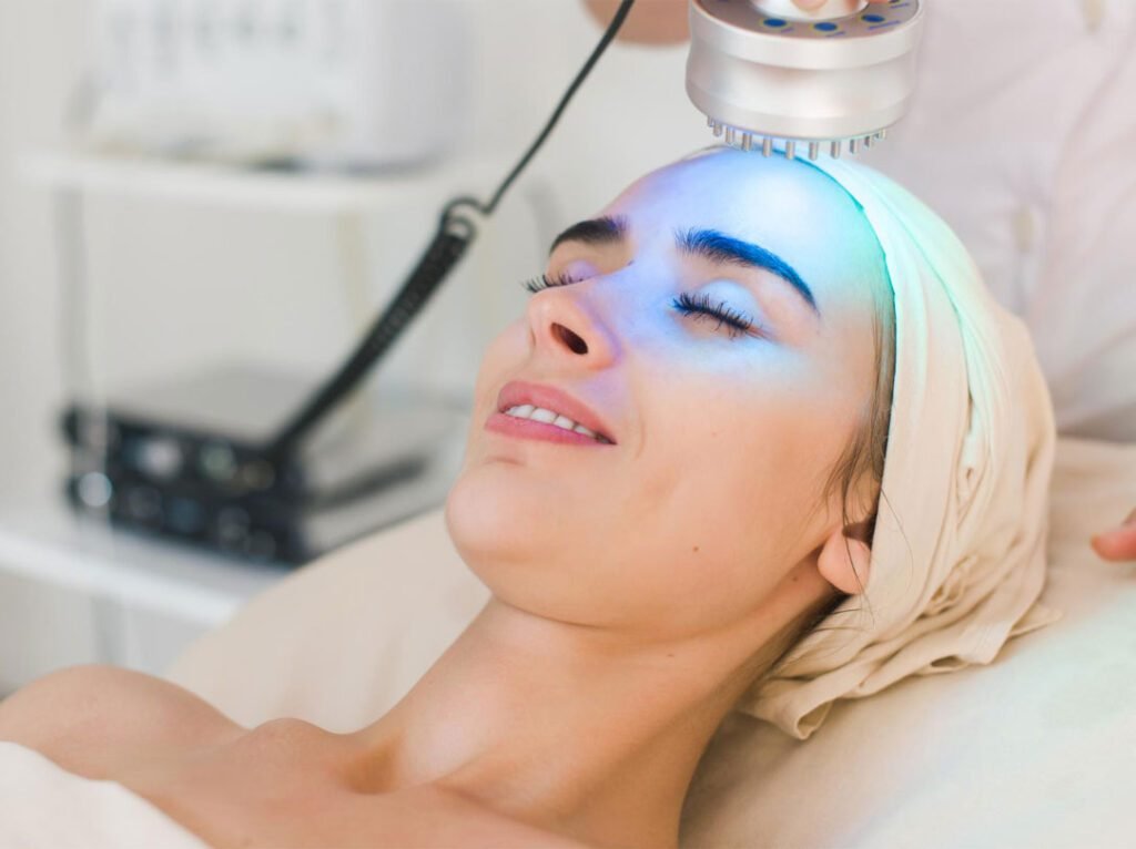 Photorejuvenation light treatment on a client's face