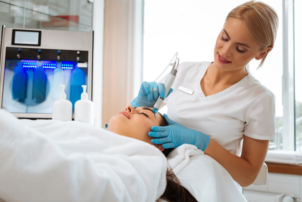 A skincare professional providing a soothing facial treatment at a Scarborough med spa, supporting confidence, wellness, and self-care in the community.