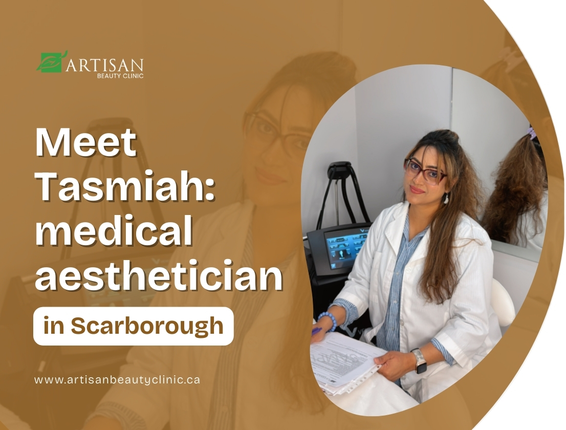 Tasmiah, a medical aesthetician, sitting in her treatment room at Artisan Beauty Clinic in Scarborough, wearing a white coat and smiling while holding client papers.