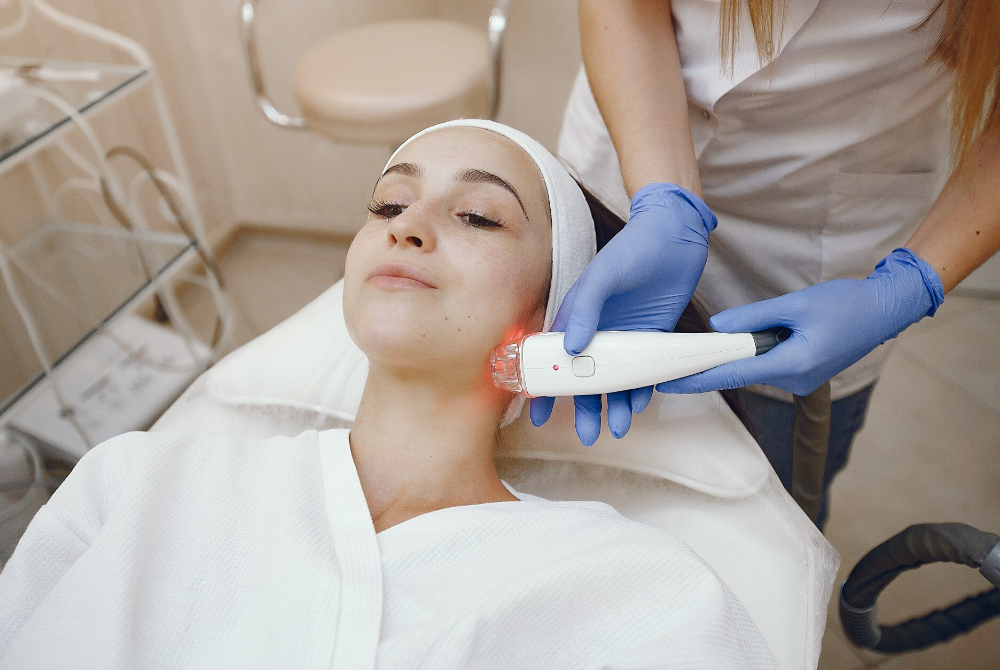 Close-up of facial skin during acne scar assessment before laser treatment
