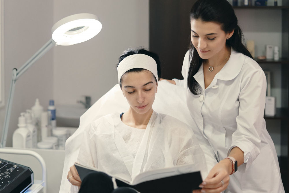 Aesthetic specialist reviewing a treatment plan with a client at a GTA med spa clinic
