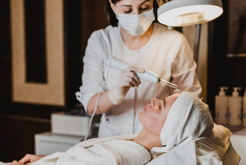Licensed aesthetic professional performing a facial treatment at a GTA med spa clinic