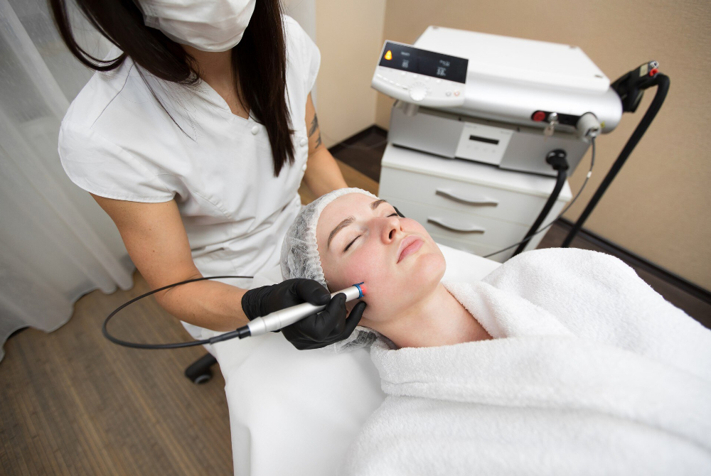 Certified practitioner performing laser pigmentation treatment in a clinic setting